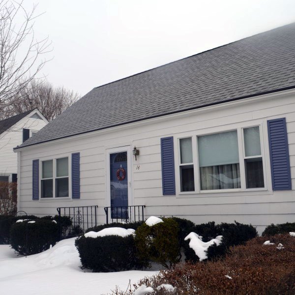 Cape style home in winter